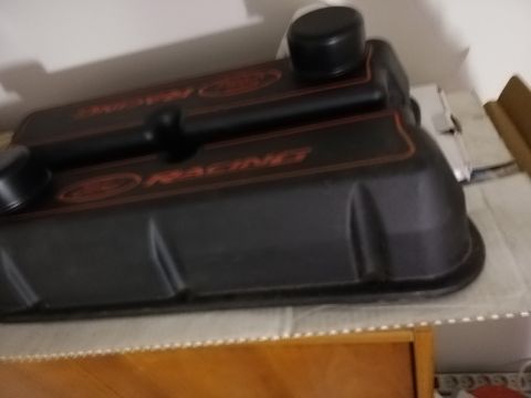 1996 Ford Bronco - These black valve covers feature orange lettering that reads "Ford Racing" and are shown on a shelf.