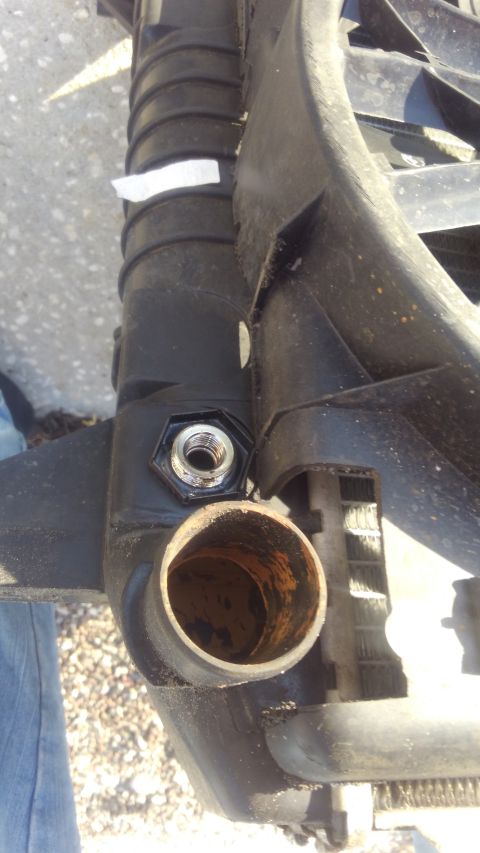 1990 Ford F-250 - the outlet needing to be trimmed to make room for the hose
