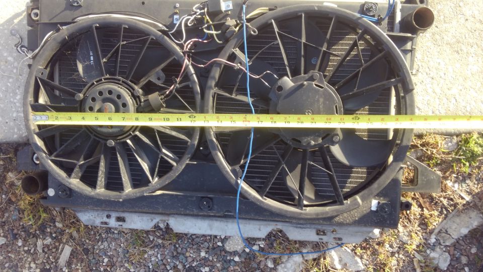 the small fan is about 12". the large fan is about 15". it pushes plenty of air

i used 2 separate single fan wiring kits. each fan is stand alone jsut incase the other fails it will not affect the other. each one has its own temp probe and adjustable dial. everything is contained onto the shroud itself for easier radiator replacement