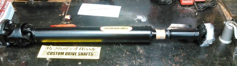 Black custom drive shaft with "My Shaft's A Woody Custom Drive Shafts" sticker