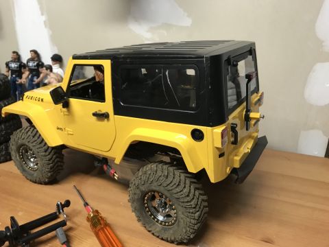 1989 Ford Bronco - Remote control Jeep Wrangler model with "RUBICON" and "Jeep T" decals on display.