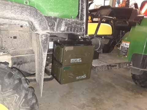 1994 Ford Bronco - John Deere Gator utility vehicle with stacked ammo cans. Another green vehicle is visible in the background.