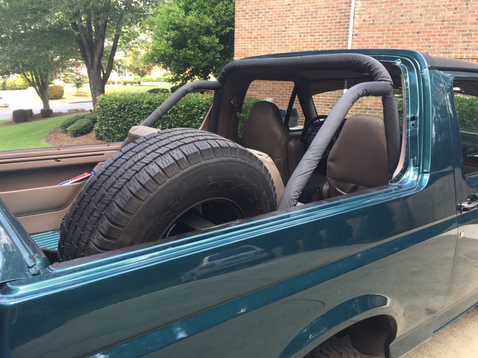 1996 Ford Bronco interior with spare tire in rear
