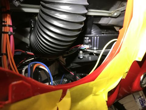 1964 Ford Fairlane - A complex network of wires and a large flexible duct are visible within the vehicle's interior.