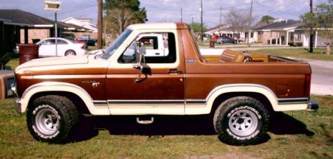 1980 Ford Bronco - Side view of a two-tone brown and white 1980 Ford Bronco convertible.