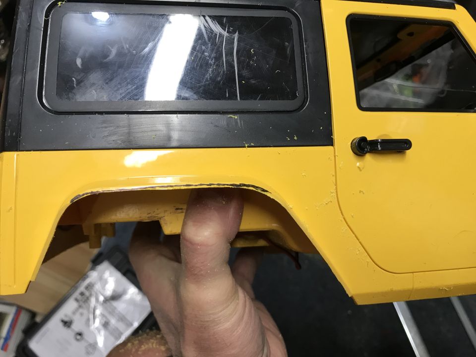 Yellow and black toy car body, side view