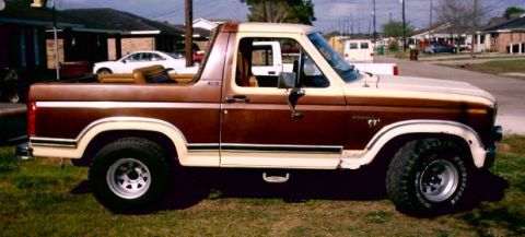 1980 Ford Bronco - Side view of a two-tone Ford Bronco with a brown and tan exterior, parked outdoors.