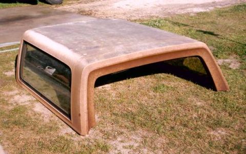 1980 Ford Bronco - Removed hardtop for a 1980 Ford Bronco is shown outdoors.