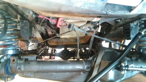 1978 Ford Bronco - This photo shows the underside of a vehicle, focusing on the suspension and axle components.