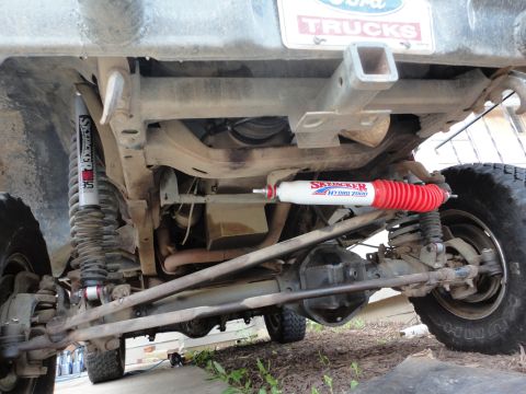 1978 Ford Bronco - This photo shows the undercarriage of a truck, focusing on the rear suspension and axle components.