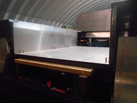 1992 Ford Bronco - Custom truck bed construction with engine components visible in the background.