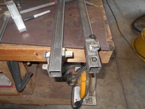 1992 Ford Bronco - Metal components are secured to a workbench, suggesting ongoing fabrication or repair work.