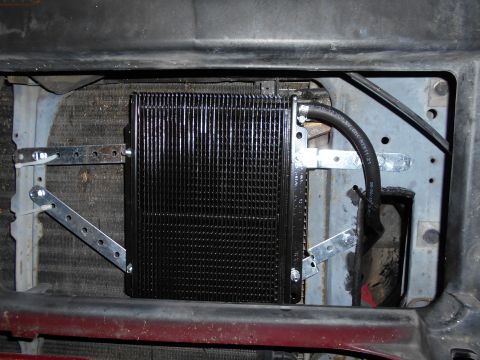 1992 Ford Bronco - Mounted in front of AC condensor.