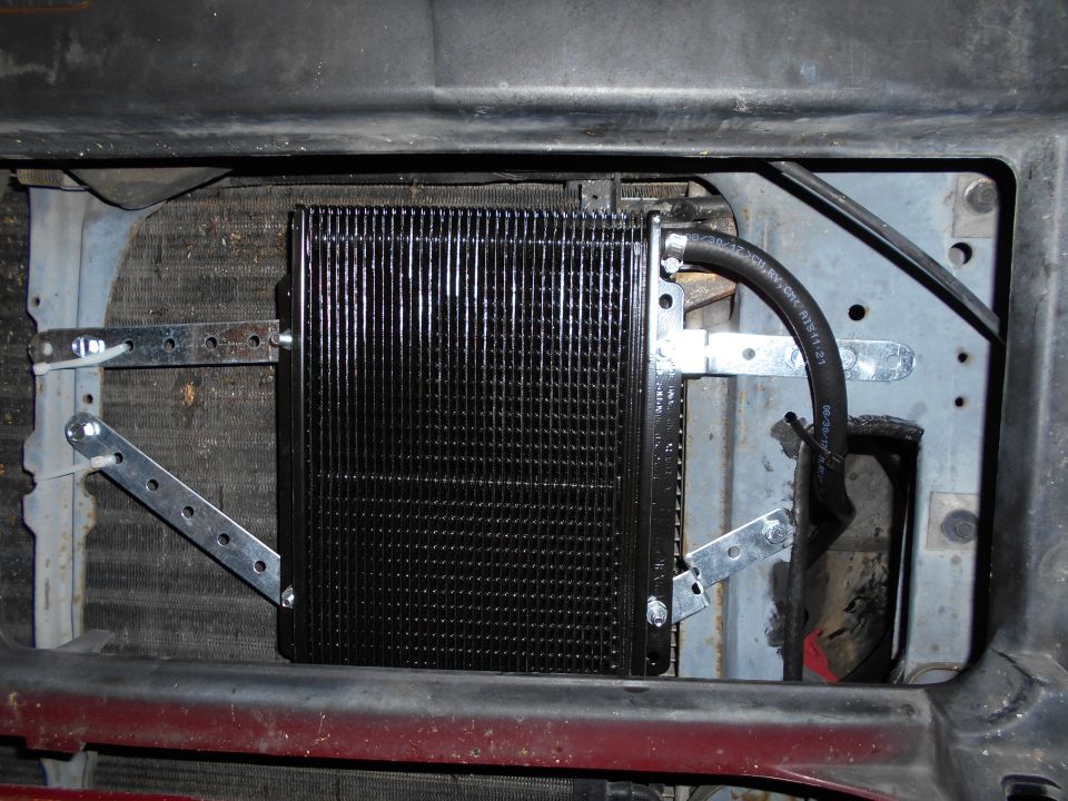 Mounted in front of AC condensor.