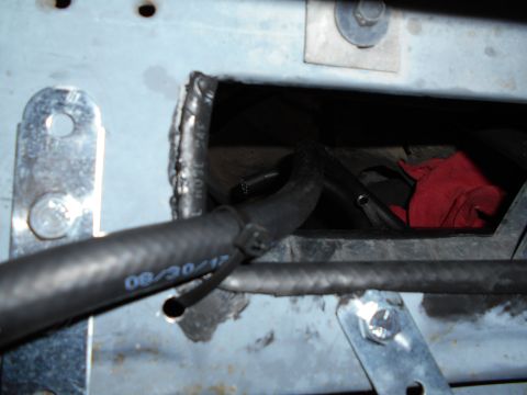 1992 Ford Bronco - Slit extra rubber hose and siliconed to the edge of opening to prevent wear on hoses.
