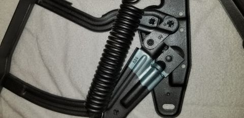 1970 Chevrolet Camaro - A close-up view shows a black metal spring mechanism with a part number "524" stamped on a silver bracket. The mechanism appears to be a co…