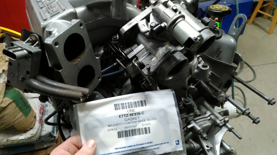 After mounting the plenum, the throttle body (carefully sandblasted & clearcoated) went on with a new gasket.