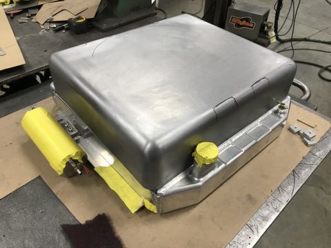 1964 Ford Fairlane - A custom aluminum fuel tank is shown mounted on top of an aluminum radiator. The fuel tank has yellow tape covering a fill cap and a yellow…