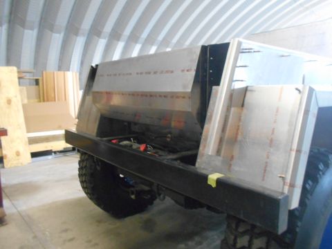 1992 Ford Bronco - The rear section of a custom-built aluminum truck bed is shown mounted on a vehicle chassis. The bed features angular panels and visible ri…
