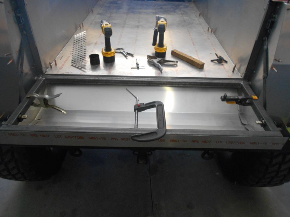 Metal bed frame with tools and clamps