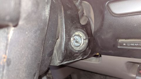 1995 Ford Bronco - Interior view of a vehicle's ignition cylinder, with partial text 'REAR D' visible on the dashboard.