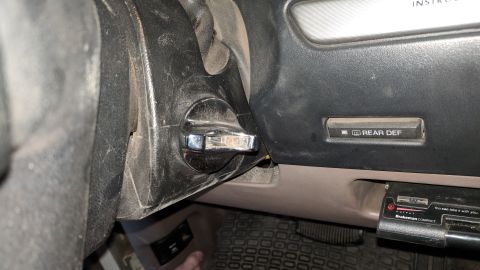 1995 Ford Bronco - Interior view of a 1995 Ford Bronco, highlighting the ignition and rear defroster controls.