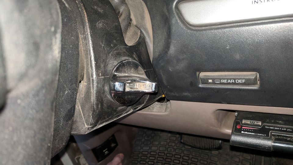 1995 Ford Bronco interior showing ignition switch and rear defroster button