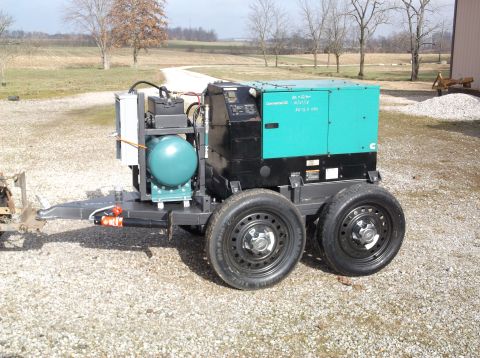 1984 Honda ATC 250 R - A trailer-mounted generator unit is shown outdoors on a gravel surface.
