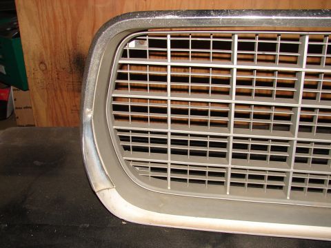 1973 Ford Ranchero - Close-up of a 1973 Ford Ranchero grille, showing its distinctive horizontal bar pattern.