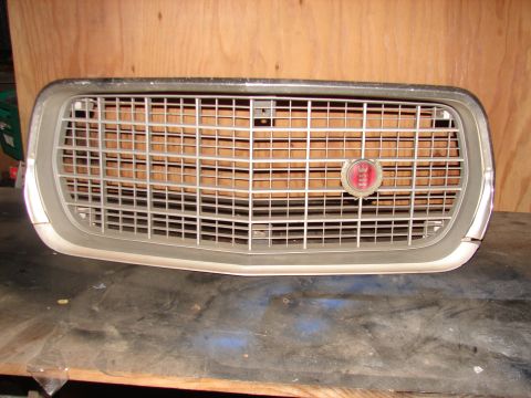 1973 Ford Ranchero - Front grille assembly for a 1973 Ford Ranchero, a red oval emblem.