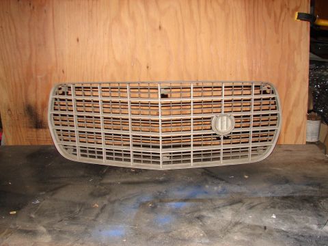 1973 Ford Ranchero - This is a car grille, likely a replacement part, shown against a wooden background.