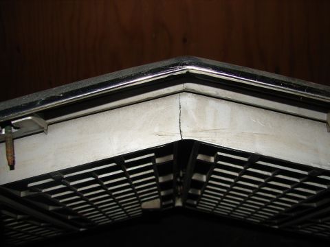 1973 Ford Ranchero - The corner of a vehicle's grille shows a chrome bumper and black grid pattern.