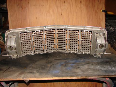 1973 Ford Ranchero - Grille assembly with integrated headlight bezels, likely from a 1970s American car.