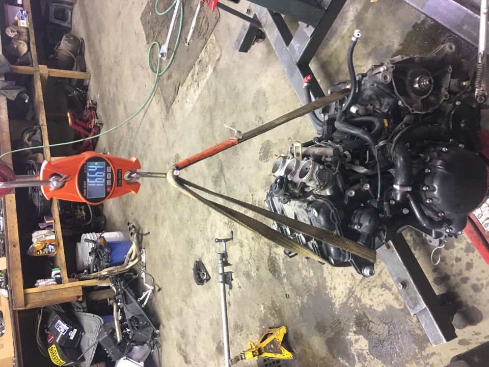 Engine on a hoist scale reading 166.4 lbs