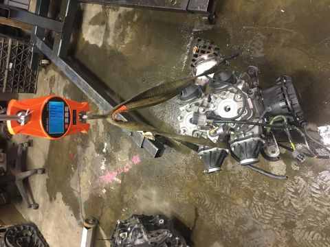 2000 Ford E350 - An engine assembly is weighed on an orange digital scale, indicating 109 lbs.