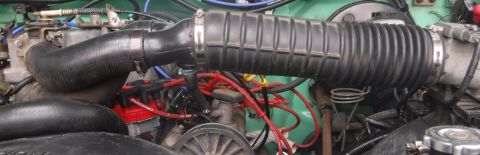 1992 Ford Bronco - MAF main intake tube mounted to chopped SD twin tubes for their horizontal arrangement, MAF y-pipe turned 90 degrees. Opened up just enough…