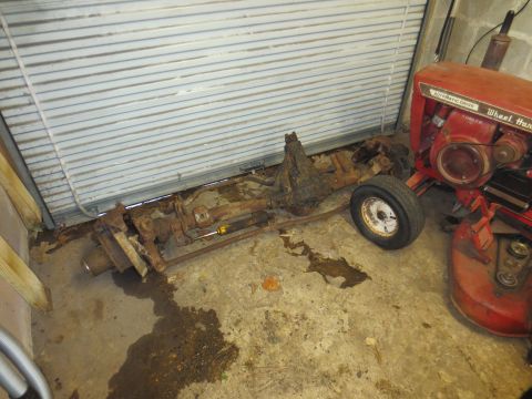 1967 Ford F-250 - Drivetrain assembly and a Wheel Horse lawn tractor are stored indoors.