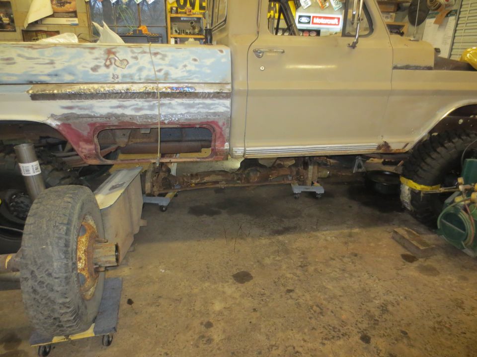 1967 Ford F-250 side view showing frame and drivetrain in repair