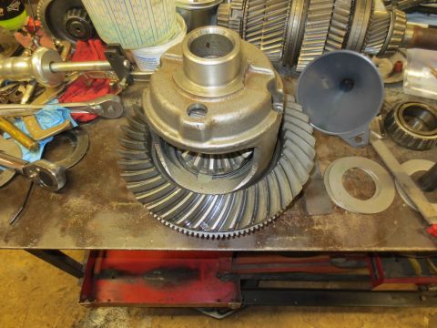 1967 Ford F-250 - A differential gear set is disassembled on a workbench with various tools.