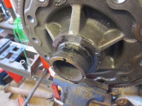 1967 Ford F-250 - Close-up of a differential housing part, possibly from a Ford F-250, secured in a vise.