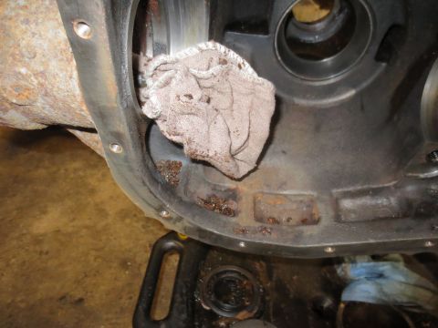 1967 Ford F-250 - Close-up view of a differential housing with a dirty rag stuffed inside, indicating wear and tear.