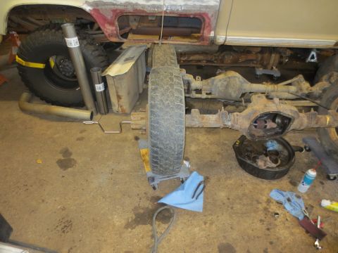 1967 Ford F-250 - Drivetrain components of a 1967 Ford F-250 truck are laid out for repair or replacement.