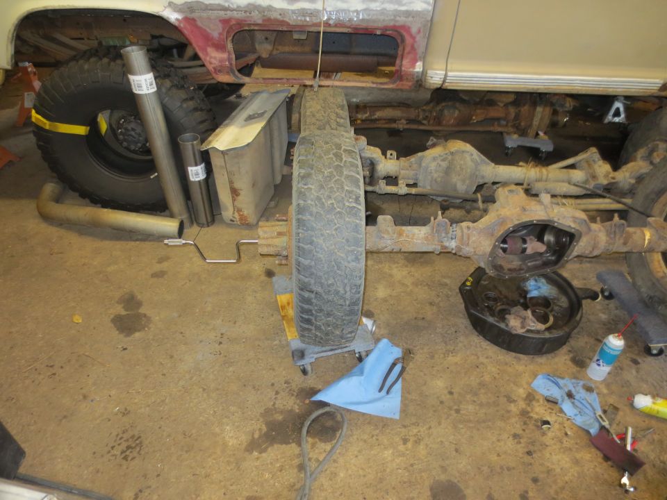 1967 Ford F-250 frame with rear axle removed, exhaust pipe, and spare tire