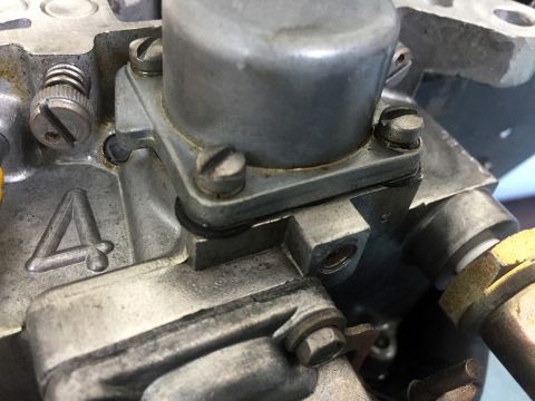 1978 Ford Bronco - Close-up view of a carburetor component, showing mechanical details and a cast number.