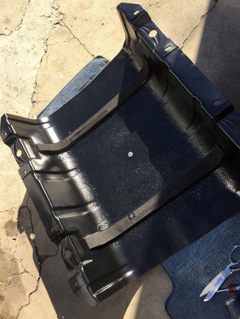 1978 Ford Bronco - A close-up view of a vehicle's fuel tank component, possibly undergoing maintenance or replacement.