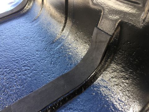 1978 Ford Bronco - Close-up view of the interior of a fuel tank, showing a textured surface and a rubber seal.