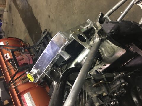 2000 Ford E350 - Close-up view of engine components and an aftermarket aluminum radiator.