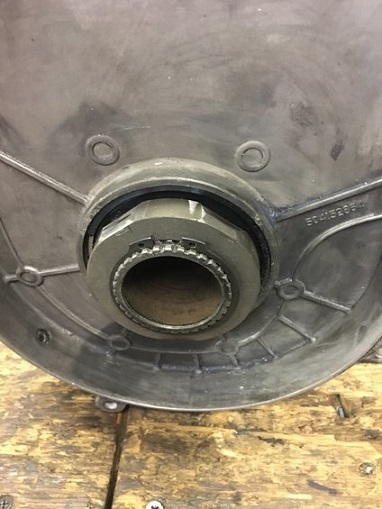 2000 Ford E350 - Close-up of a metal automotive part with visible text and a splined shaft.