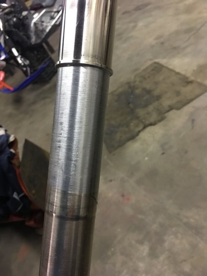 2000 Ford E350 - Close-up view of a metal shifter sled, showing signs of wear and tear.