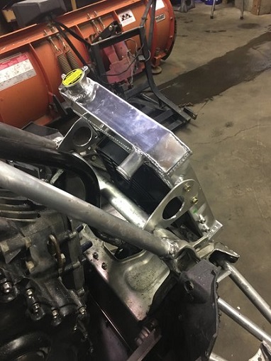 2000 Ford E350 - Aftermarket aluminum radiator installed in front of a snow plow.